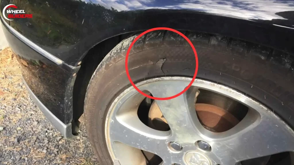 Damaged sidewall tire of a car