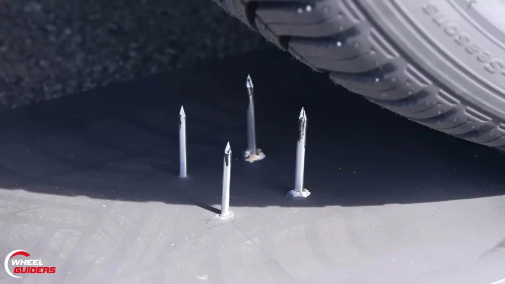 Testing run flat tire by driving them on screws